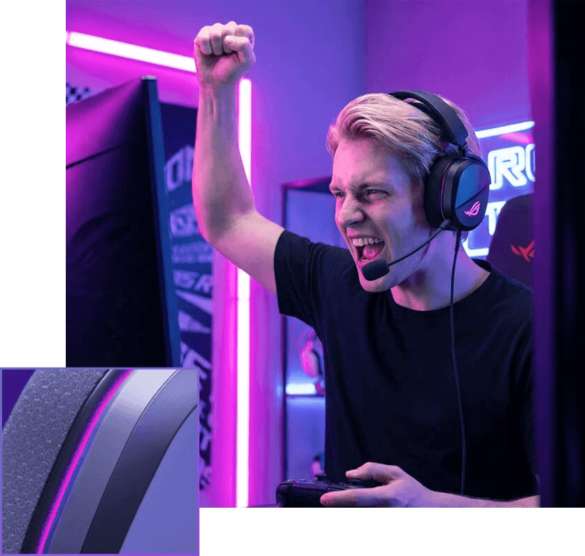 An excited male gamer wearing an ROG Pelta Core gaming headset, raising his fist to celebrate a win.